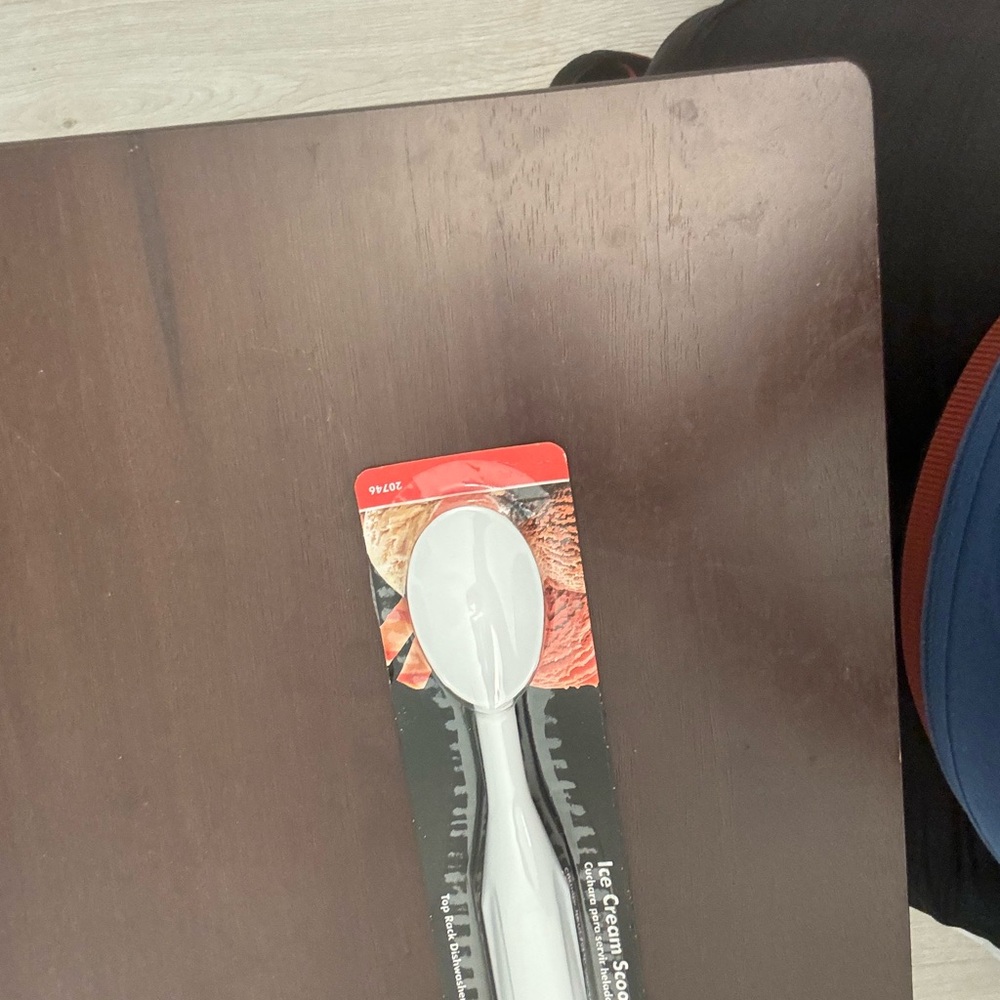 It is a white ice cream scoop